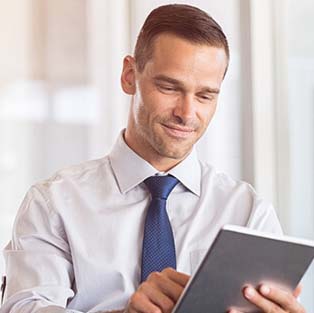 business man viewing account on tablet