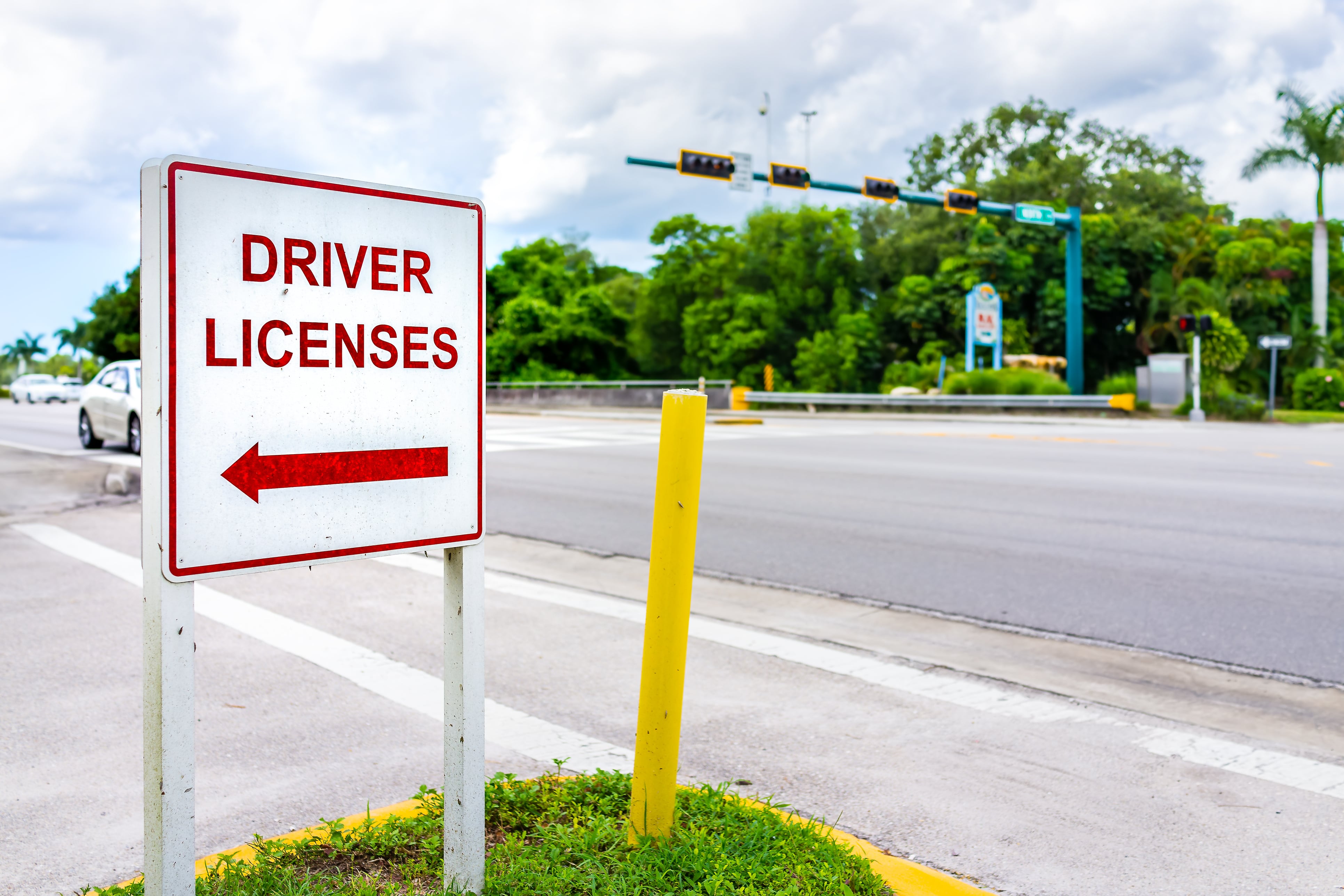 Roadside signpost for directions to DMV
