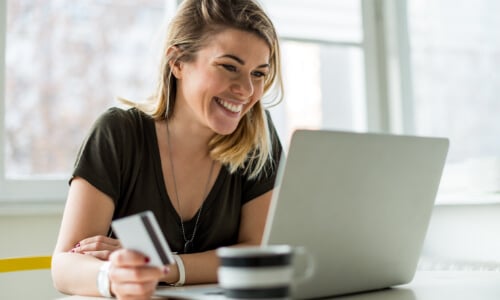 Woman online shopping with credit card