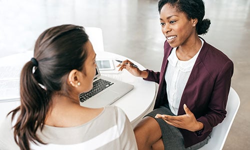 Women discussing finances together