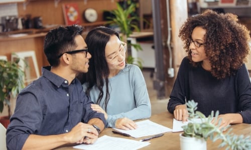 A couple talking to a home loan officer