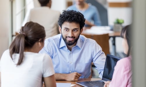 Academic advisor talking with college student