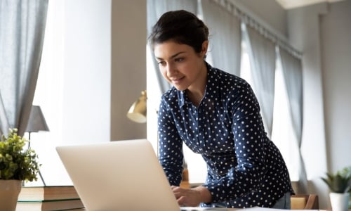 A person typing on a laptop