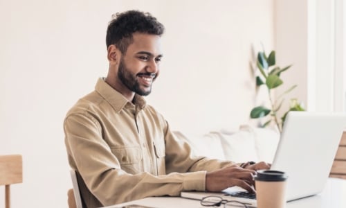 A person typing on a laptop