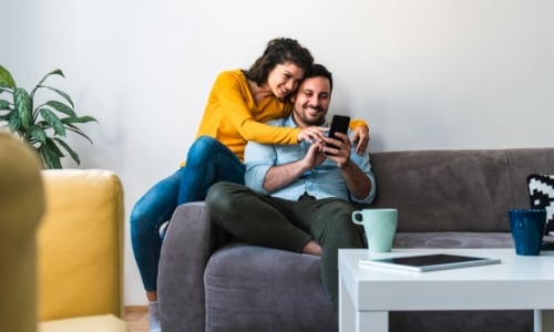 A couple looking at a phone together