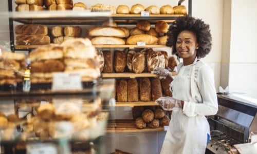 A business owner standing in a bakery