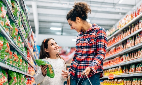 A parent and child grocery shopping