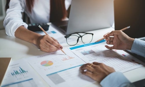 Group of businesswomen checking business reports