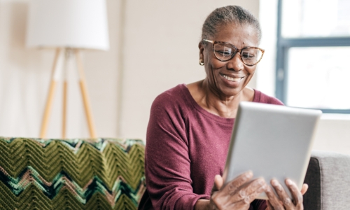 Retired person looking at retirement options online