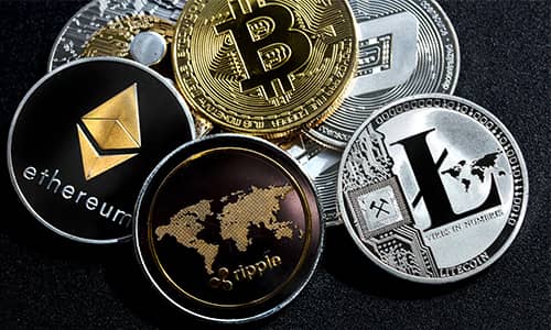 Close up of crypto coins on a metallic black background