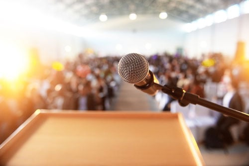 A microphone and podium set up for a public speaker