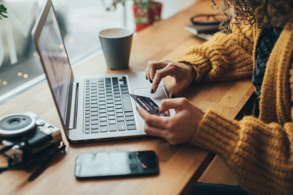 Woman online shopping with credit card