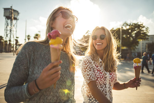 Two people enjoying ice cream cones