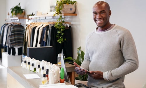 man behind the counter of a store