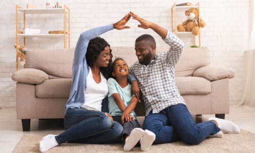 Family happy together making a house shape