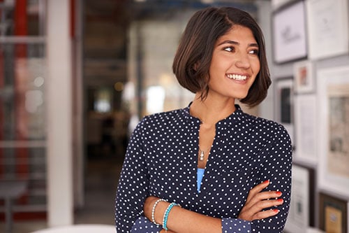 A business woman standing in her office