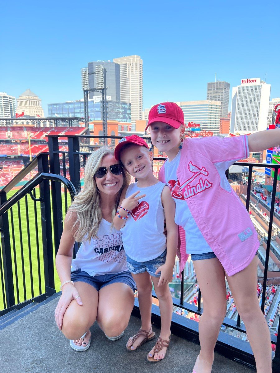 Justina and her daughters at a Cardinals game