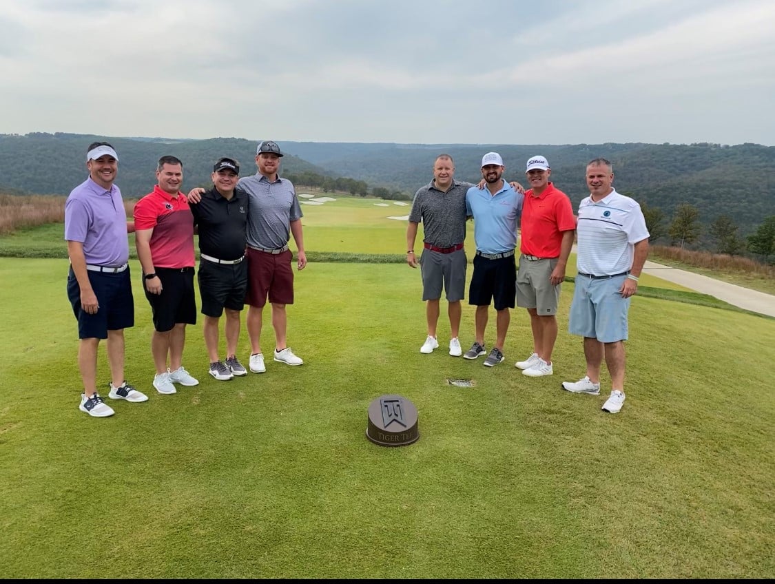 Greg on the golf course with friends