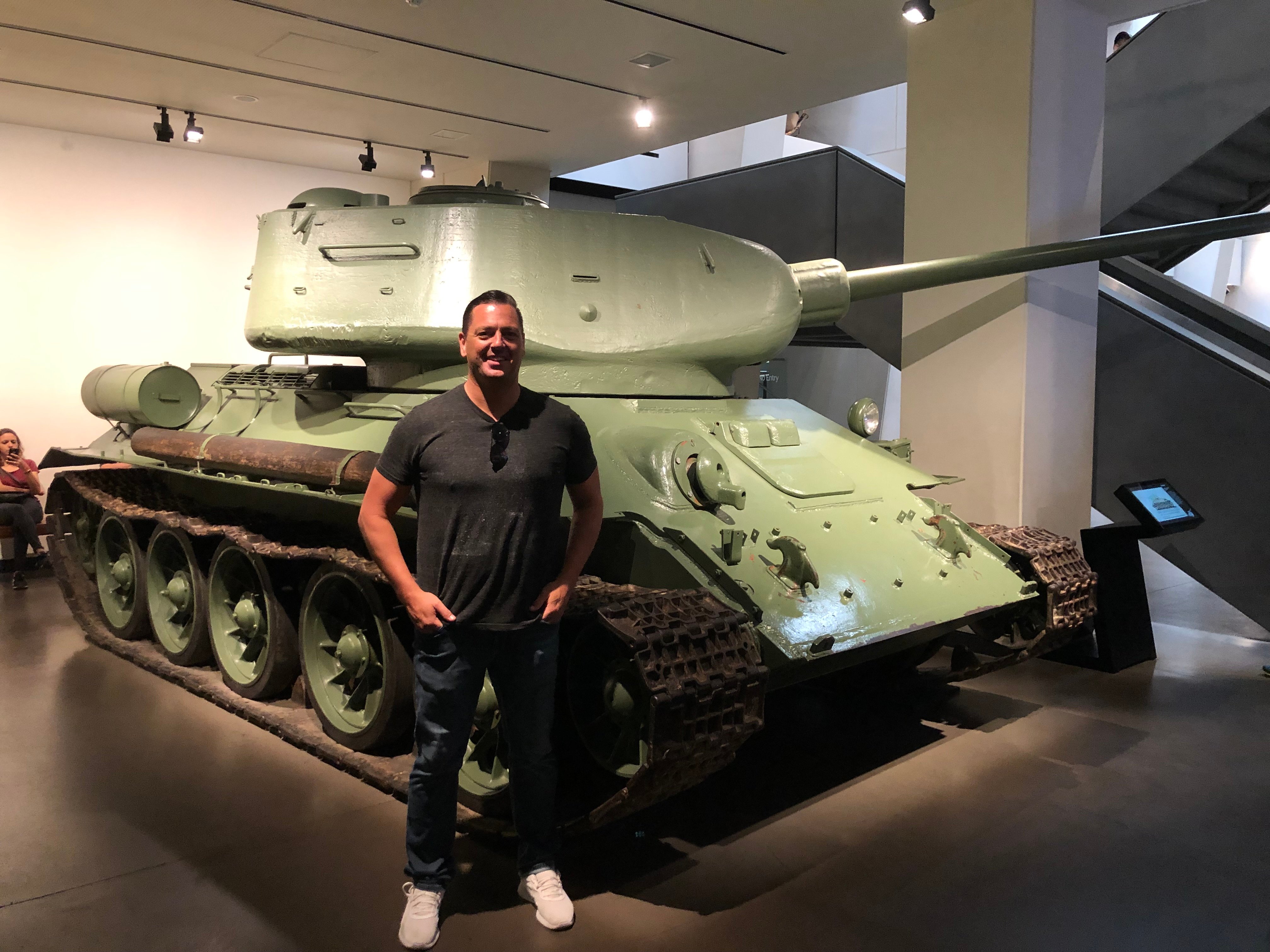Matthew standing with a tank