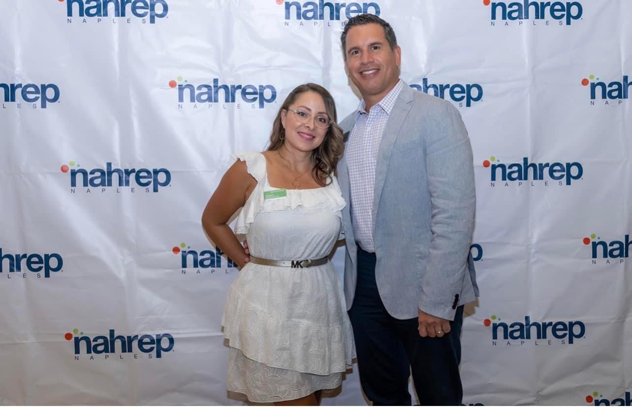 Angela standing with husband