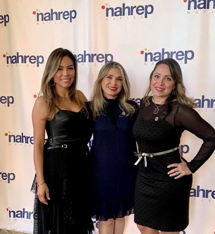 Angela posing with co-workers