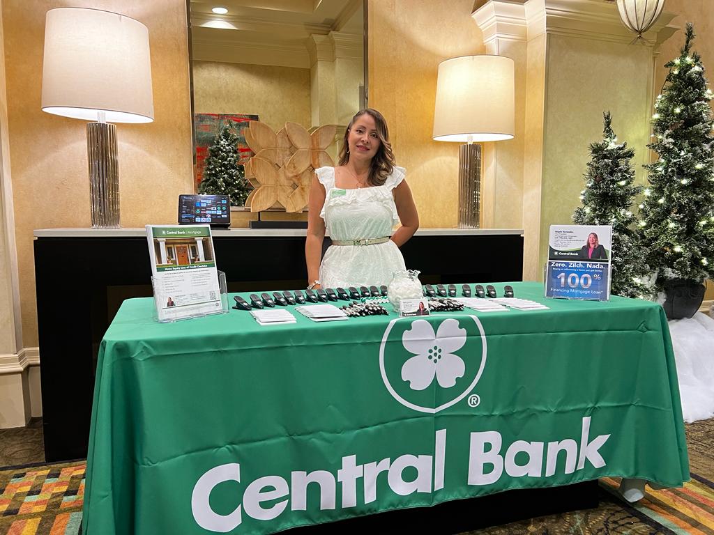 Angela posing at Central Bank booth