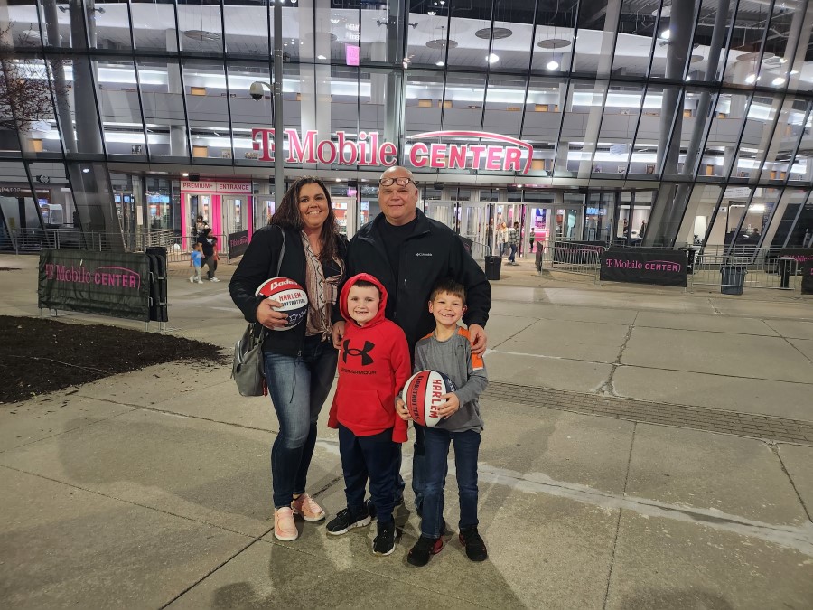 Stephanie with family in front of T Mobile Center