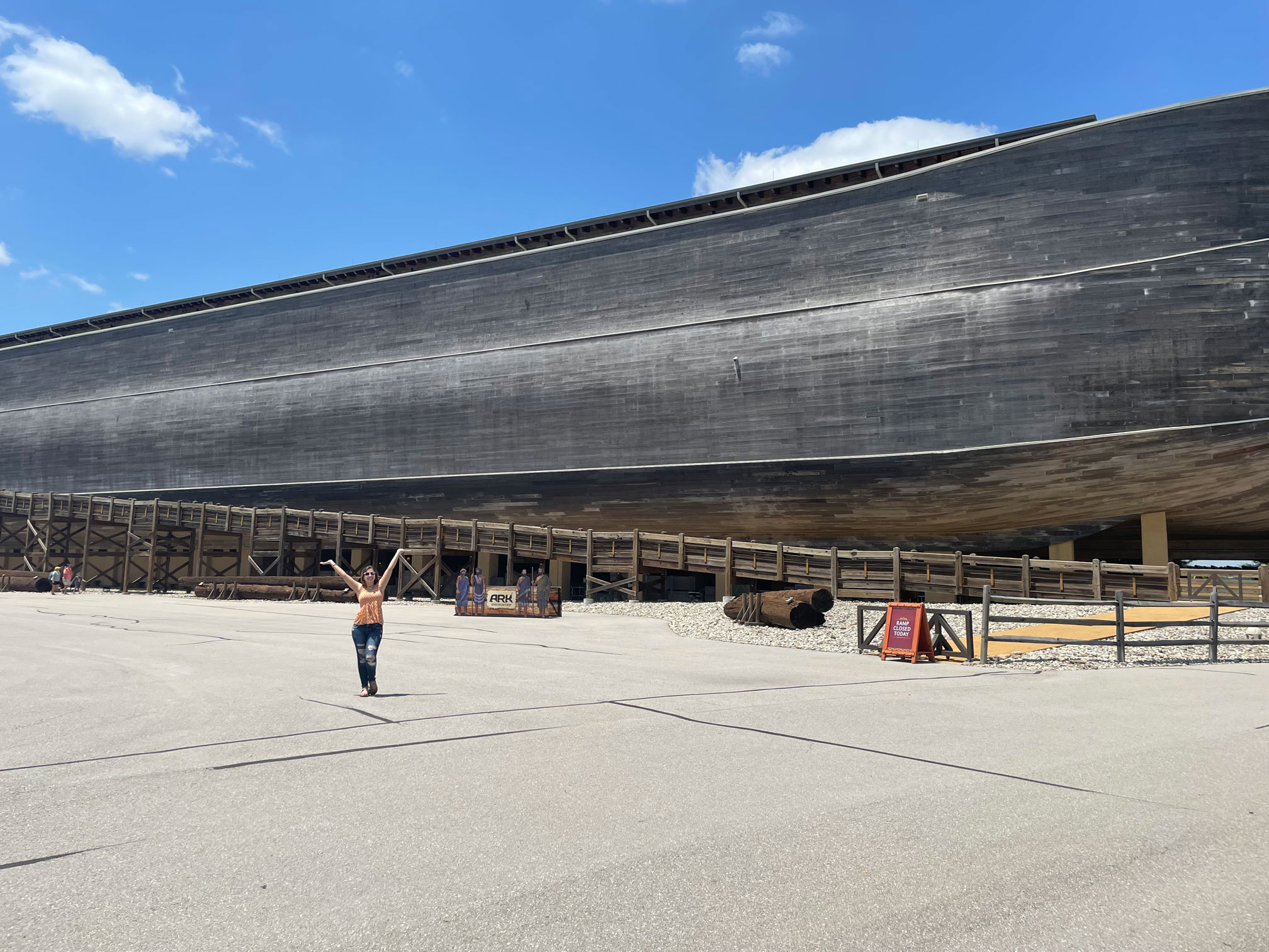 Elizabeth Riggins in the distance, next to a ARK replica