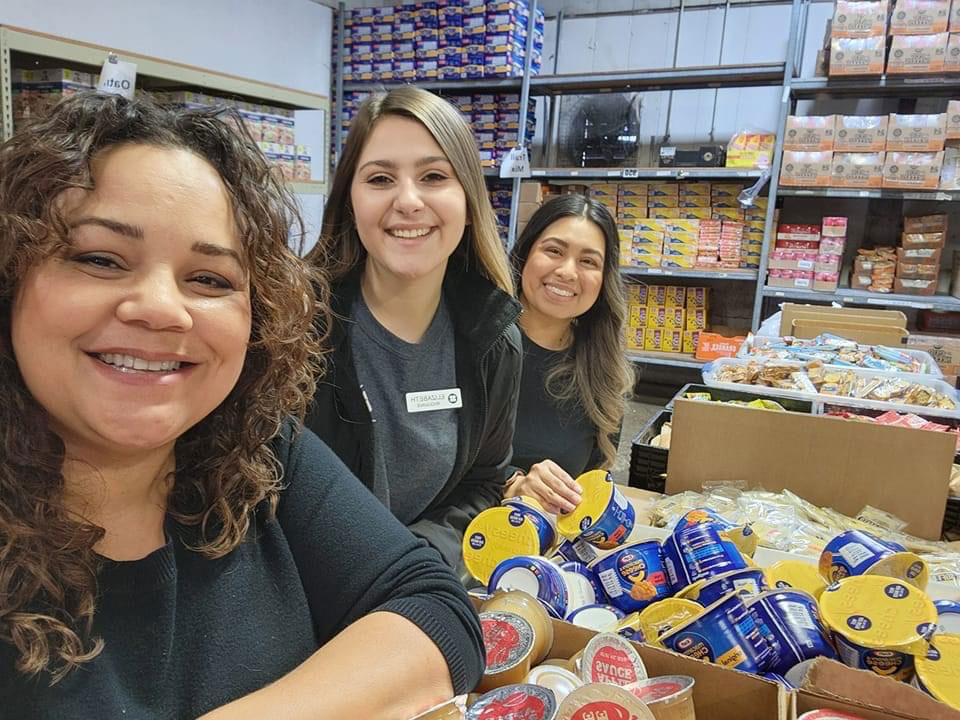 Elizabeth Riggins helping out in a food drive