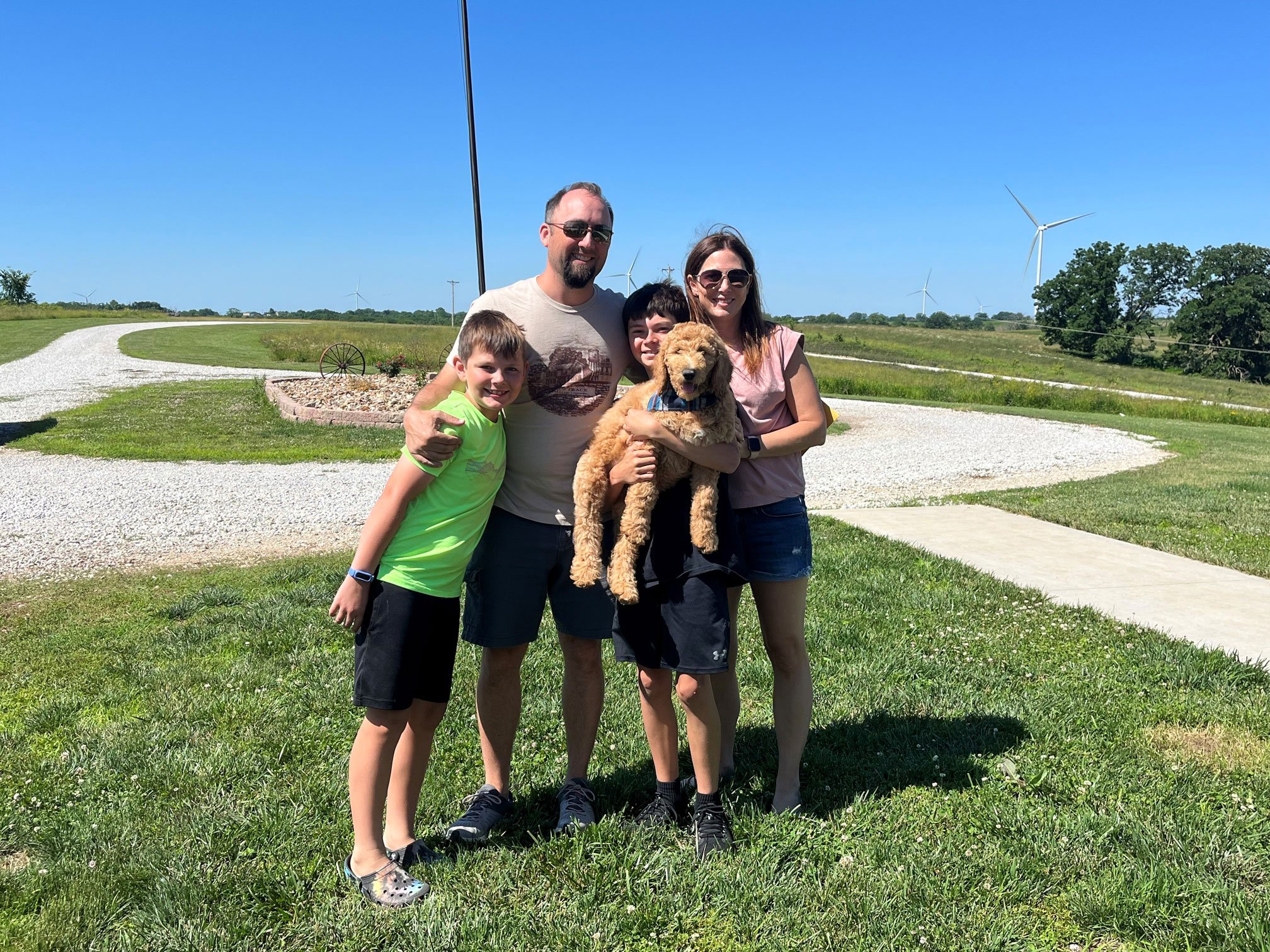 CO Scheffer and his family huddled together, posing for a picture