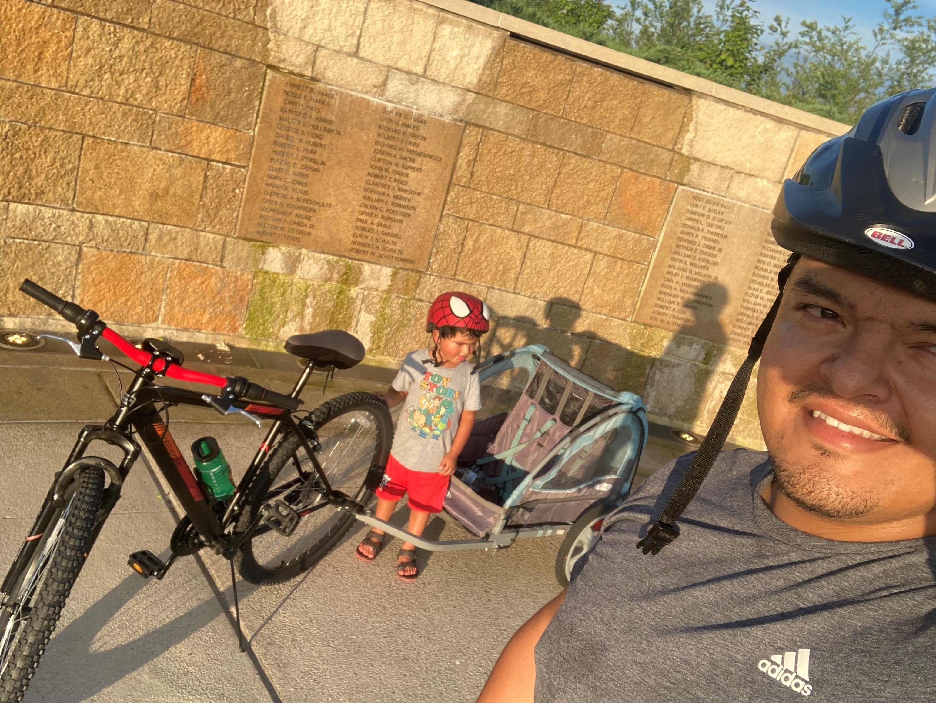 Rodrigo and his son biking