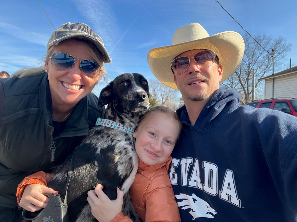 Ryan White's family posing with the family dog