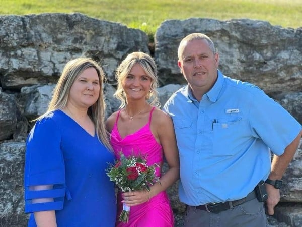 Tamara with her husband and daughter dressed up for a dance