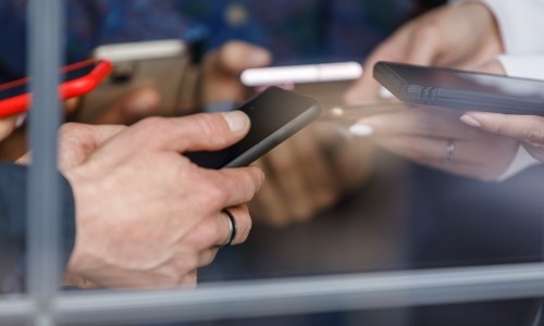 Group of people using their cell phones