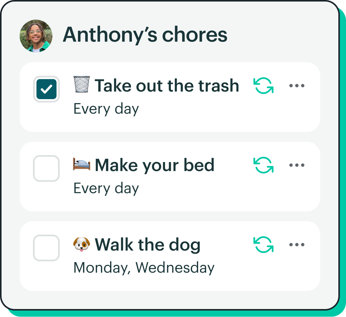 Father giving daughter chore money with Greenlight card