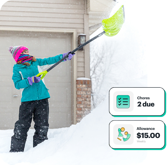 Father giving daughter chore money with Greenlight card