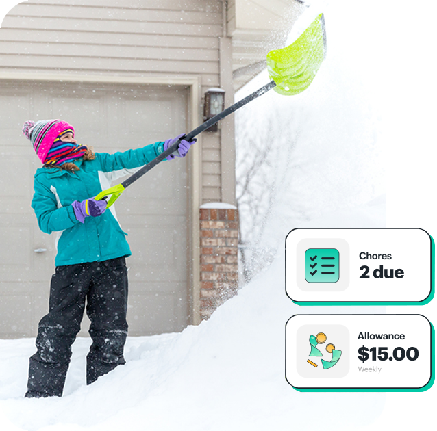 Father giving daughter chore money with Greenlight card