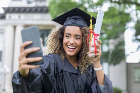 MBA students taking a selfie on graduation day