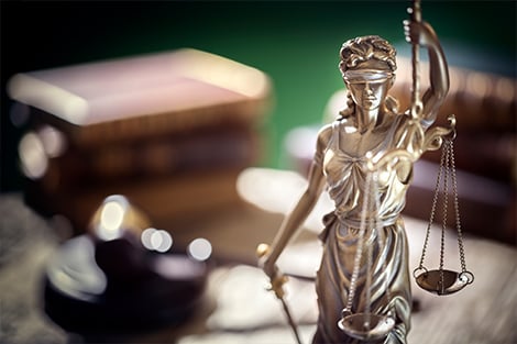 Lady Justice statue sitting on a desk
