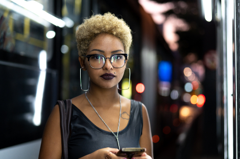 a woman holding her smartphone