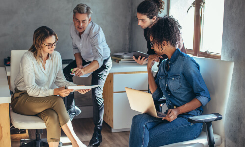 Employees collaborating in a meeting