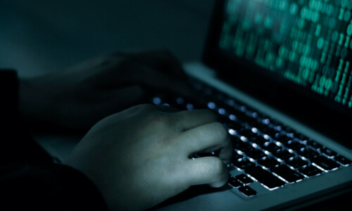 Hands typing on keyboard
