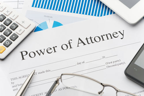 Power of attorney paperwork sitting on a desk