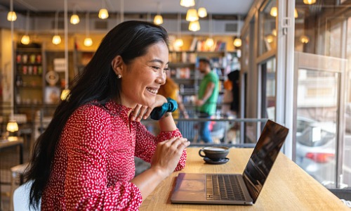 Woman using Wi-Fi in a coffee shop